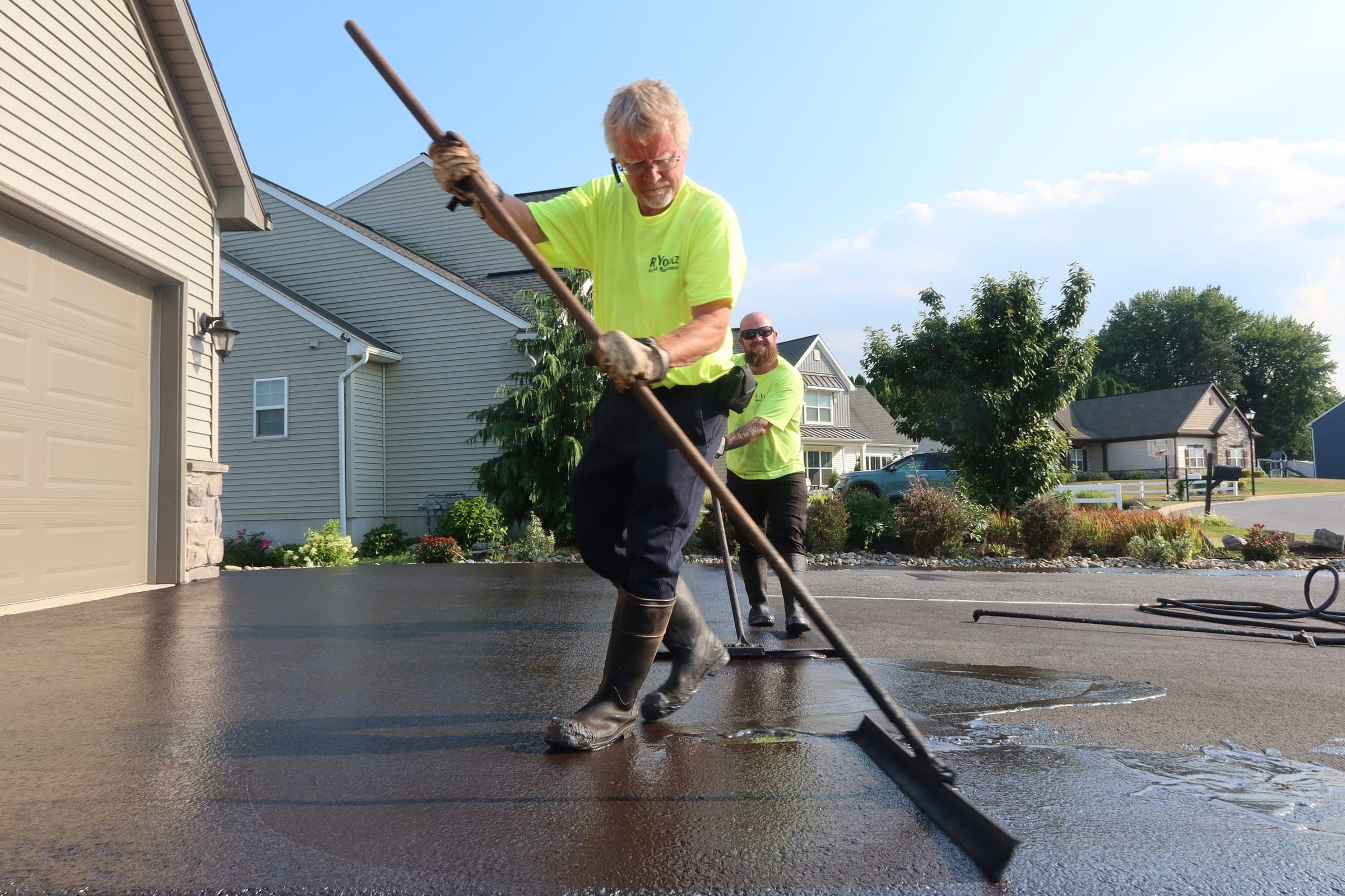 Two-worker brush crew from R. Youtz Asphalt Maintenance